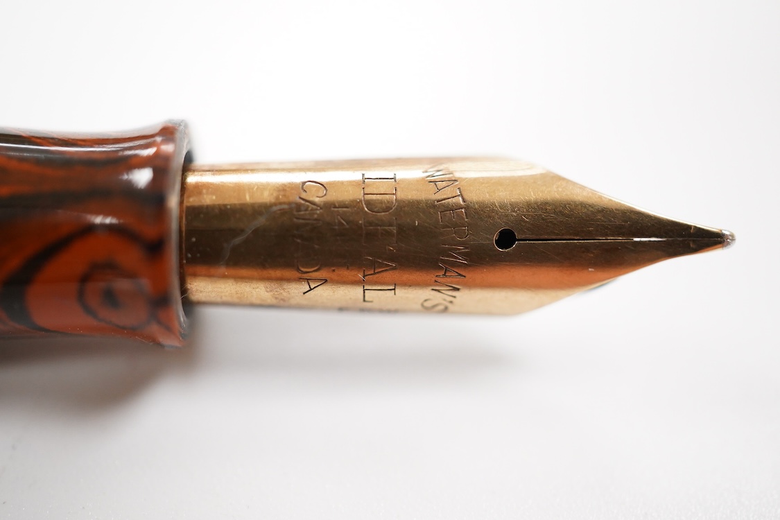 A Waterman Red Ripple No.7 lever filler with yellow cap band and fitted with a Waterman nib